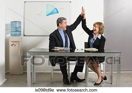 Businesspeople doing high five View Large Photo Image Stock Image - Businesspeople doing high five. Fotosearch