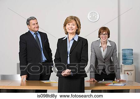 Businesspeople in office View Large Photo Image Stock Photo - Businesspeople in office. Fotosearch