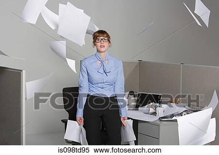 Businesswoman throwing paper into the air View Large Photo Image Stock Photography - Businesswoman throwing paper into the air. Fotosearch