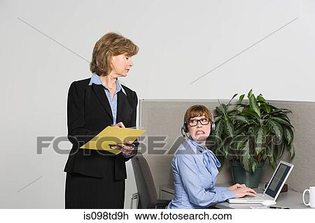 Businesswoman watching over work View Large Photo Image Stock Image - Businesswoman watching over work. Fotosearch
