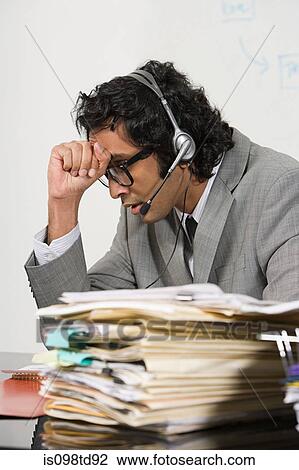 Stressed businessman with head in hands View Large Photo Image Stock Image - Stressed businessman with head in hands. Fotosearch