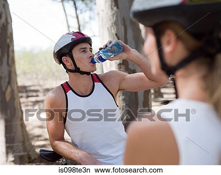 Picture - Young couple cycling. Fotosearch