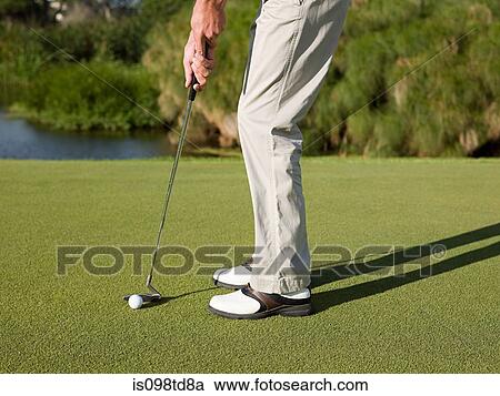 Man playing golf on golf course View Large Photo Image Stock Image - Man playing golf on golf course. Fotosearch