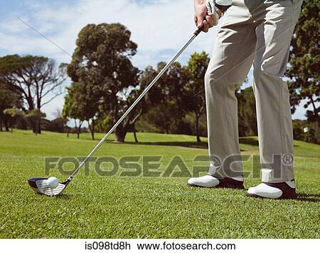 Man playing golf on golf course View Large Photo Image Stock Image - Man playing golf on golf course. Fotosearch