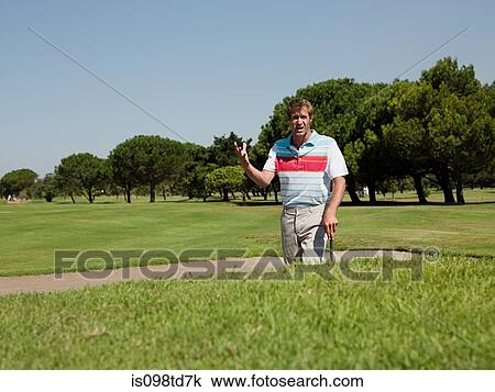 Man playing golf, stuck in bunker View Large Photo Image Stock Image - Man playing golf, stuck in bunker. Fotosearch