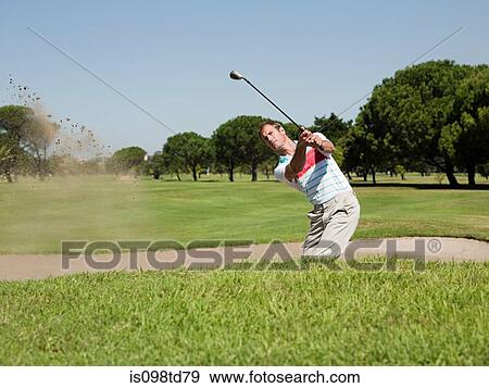 Man playing golf, stuck in bunker View Large Photo Image Stock Photo - Man playing golf, stuck in bunker. Fotosearch