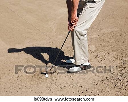 Man playing golf, stuck in bunker View Large Photo Image Stock Photograph - Man playing golf, stuck in bunker. Fotosearch
