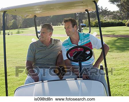 Two mature men in golf cart on golf course View Large Photo Image Picture - Two mature men in golf cart on golf course. Fotosearch
