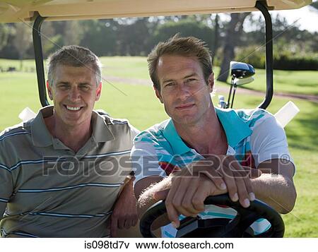 Two mature men in golf cart on golf course View Large Photo Image Stock Photo - Two mature men in golf cart on golf course. Fotosearch