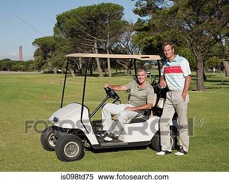 Two mature men in golf cart on golf course View Large Photo Image Stock Photography - Two mature men in golf cart on golf course. Fotosearch