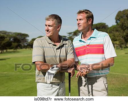Two mature men playing golf together View Large Photo Image Stock Photography - Two mature men playing golf together. Fotosearch