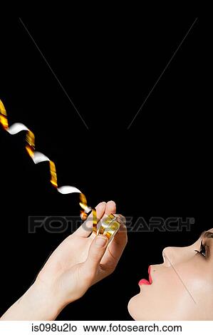 Young blonde woman with party streamer View Large Photo Image Picture - Young blonde woman with party streamer. Fotosearch
