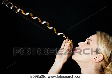 Young blonde woman with party streamer View Large Photo Image Stock Photo - Young blonde woman with party streamer. Fotosearch