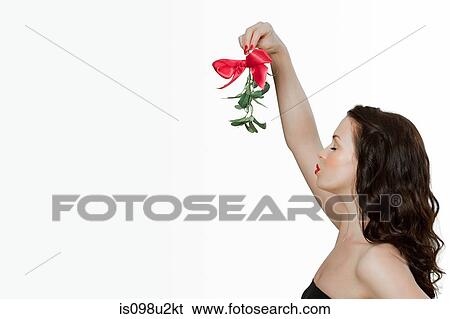 Young woman blowing a kiss View Large Photo Image Stock Photograph - Young woman blowing a kiss. Fotosearch