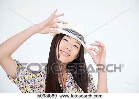 Woman wearing a trilby View Large Photo Image Stock Photo - Woman wearing a trilby. Fotosearch