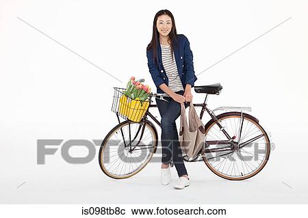 Stock Image - Woman with bicycle. Fotosearch