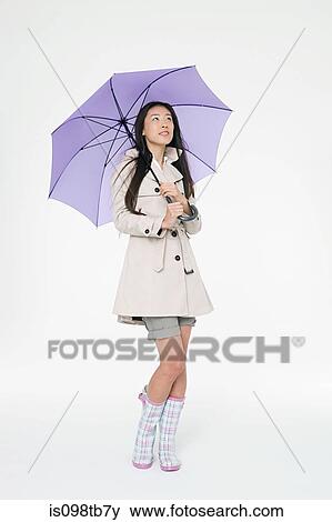 Woman with umbrella View Large Photo Image Stock Photo - Woman with umbrella. Fotosearch
