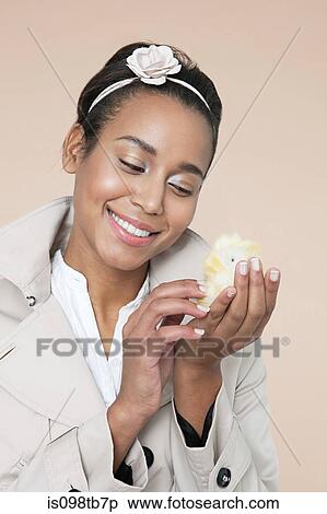 Young woman with easter chick View Large Photo Image Stock Photography - Young woman with easter chick. Fotosearch