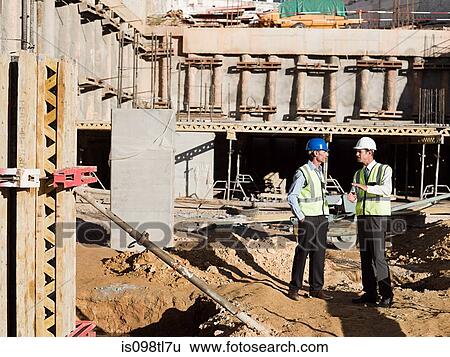 Mature men meeting on construction site View Large Photo Image Stock Photograph - Mature men meeting on construction site. Fotosearch