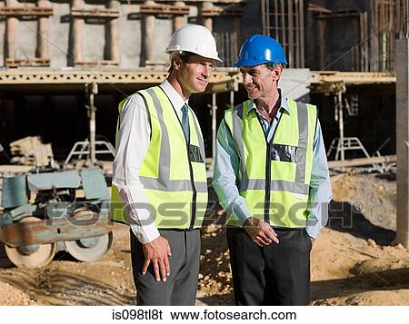 Mature men meeting on construction site View Large Photo Image Stock Photograph - Mature men meeting on construction site. Fotosearch