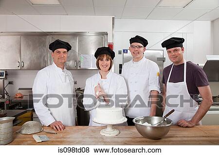 Chefs in commercial kitchen, portrait View Large Photo Image Stock Photo - Chefs in commercial kitchen, portrait. Fotosearch