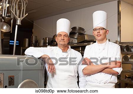 Chefs in commercial kitchen, portrait View Large Photo Image Stock Photography - Chefs in commercial kitchen, portrait. Fotosearch