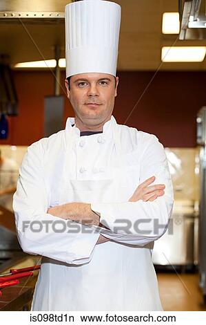 Male chef in commercial kitchen, portrait View Large Photo Image Picture - Male chef in commercial kitchen, portrait. Fotosearch
