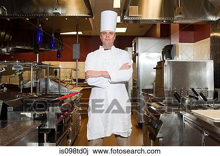 Male chef in commercial kitchen, portrait View Large Photo Image Stock Image - Male chef in commercial kitchen, portrait. Fotosearch
