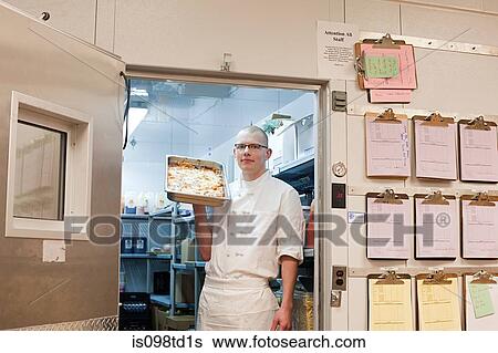 Male chef in walk in freezer in commercial kitchen View Large Photo Image Stock Photograph - Male chef in walk in freezer in commercial kitchen. Fotosearch