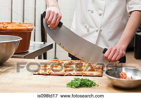 Male chef making pizza in commercial kitchen View Large Photo Image Stock Photo - Male chef making pizza in commercial kitchen. Fotosearch