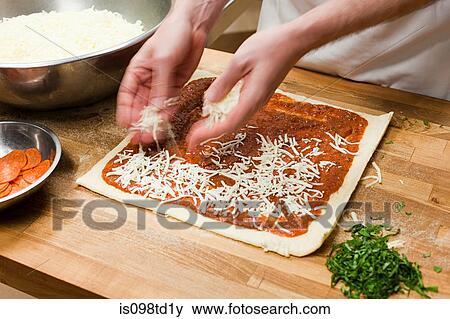 Male chef making pizza in commercial kitchen View Large Photo Image Stock Photo - Male chef making pizza in commercial kitchen. Fotosearch