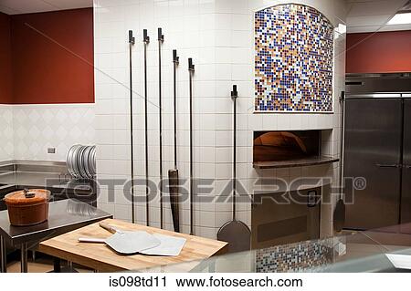 Stock Image - Pizza oven, commercial kitchen. Fotosearch