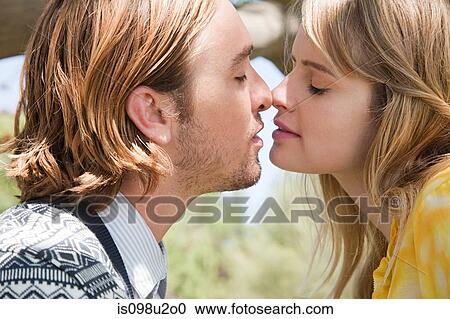 Young couple about to kiss View Large Photo Image Stock Image - Young couple about to kiss. Fotosearch