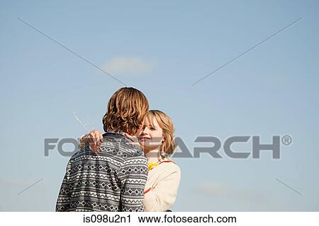 Stock Image - Young couple outdoors. Fotosearch