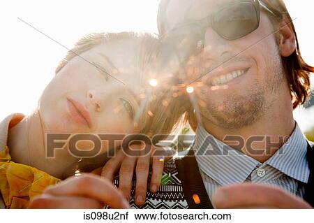 Young couple with sparklers View Large Photo Image Stock Image - Young couple with sparklers. Fotosearch