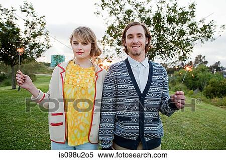 Young couple with sparklers View Large Photo Image Stock Photography - Young couple with sparklers. Fotosearch