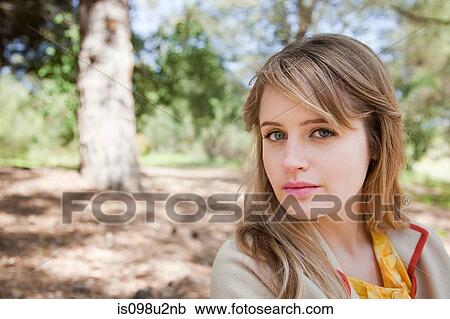 Young woman outdoors View Large Photo Image Stock Image - Young woman outdoors. Fotosearch