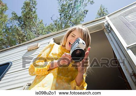 Young woman with video camera View Large Photo Image Stock Image - Young woman with video camera. Fotosearch