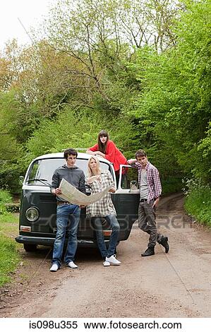 Friends by camper van with map View Large Photo Image Stock Photography - Friends by camper van with map. Fotosearch