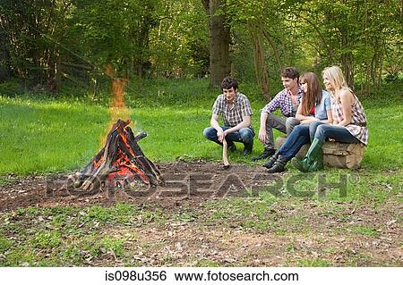 Friends by campfire View Large Photo Image Stock Photograph - Friends by campfire. Fotosearch