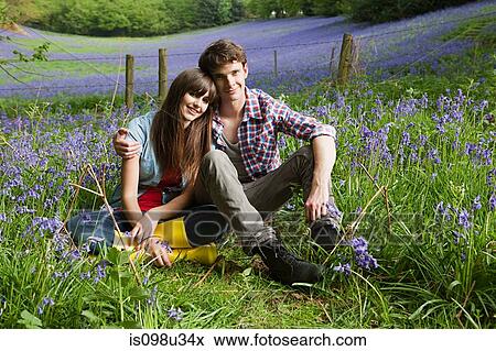 Stock Photo - Young couple in a field of bluebells. Fotosearch