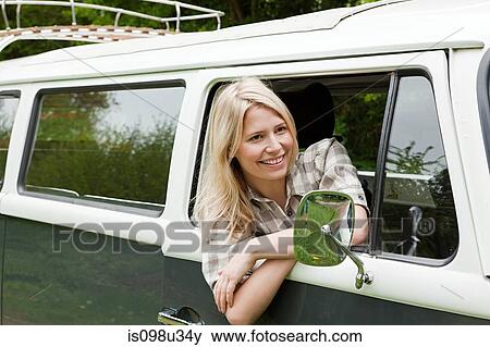 Young woman in camper van View Large Photo Image Stock Photo - Young woman in camper van. Fotosearch