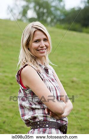 Young woman in countryside View Large Photo Image Picture - Young woman in countryside. Fotosearch