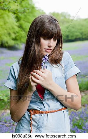 Young woman with bluebell flower View Large Photo Image Stock Photograph - Young woman with bluebell flower. Fotosearch