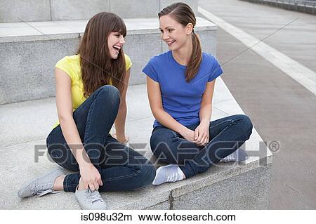 Picture - Girlfriends laughing. Fotosearch