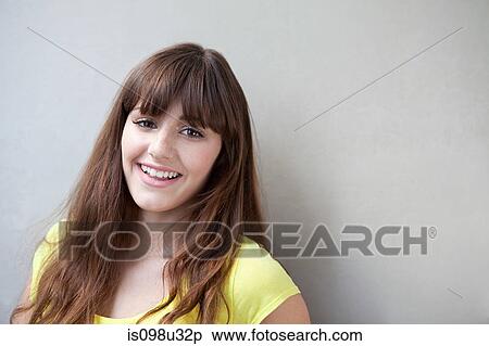 Portrait of a young woman smiling View Large Photo Image Stock Photography - Portrait of a young woman smiling. Fotosearch