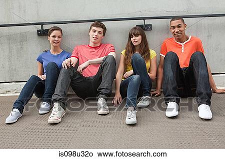 Young people sitting in row View Large Photo Image Picture - Young people sitting in row. Fotosearch