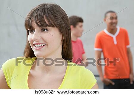 Young woman and two young men View Large Photo Image Stock Photography - Young woman and two young men. Fotosearch