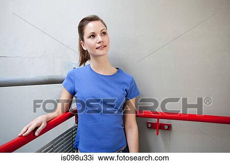 Young woman looking up View Large Photo Image Stock Image - Young woman looking up. Fotosearch