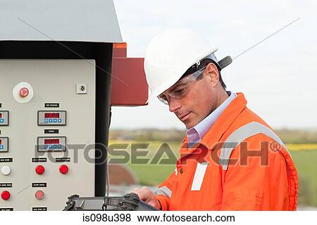 Engineer by control panel View Large Photo Image Stock Photo - Engineer by control panel. Fotosearch